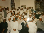 The Jamaa'ah taking bay’ah at the hands of Imām Abdullatief Bābu Purkar al-Shāfi’ī al-Qādirī al-Chishtī (1926-2004) beside the holy grave of Maulānā ’Abd Al-Laṭīf bin Qāḍī Muḥammad Yūsuf al-Ṣiddīqī (1860-1916).jpg